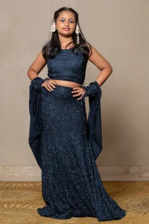 Exquisite navy blue crop top and Lahenga with intricate beadwork and dramatic sleeves, perfect for making a sophisticated statement at formal events.